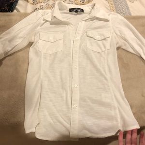 White button down, women’s cut. Stretchy sides.